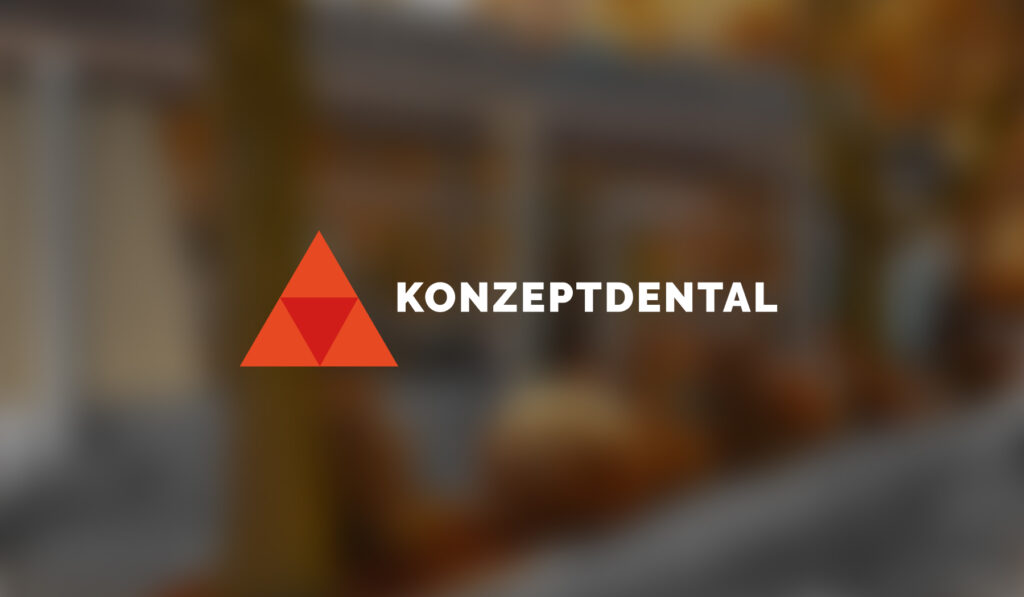 KonzepDental Logo auf unscharfem Hintergrund, Zahnarztpraxis-Schild.